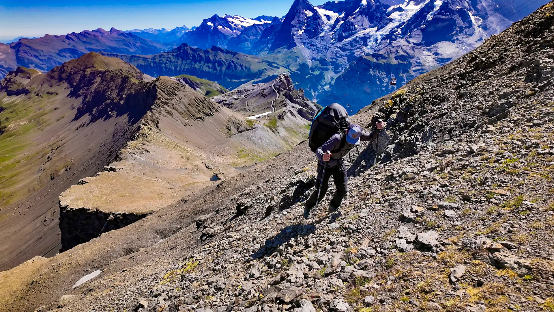 Pilot hiking to a hike-and-fly launch site